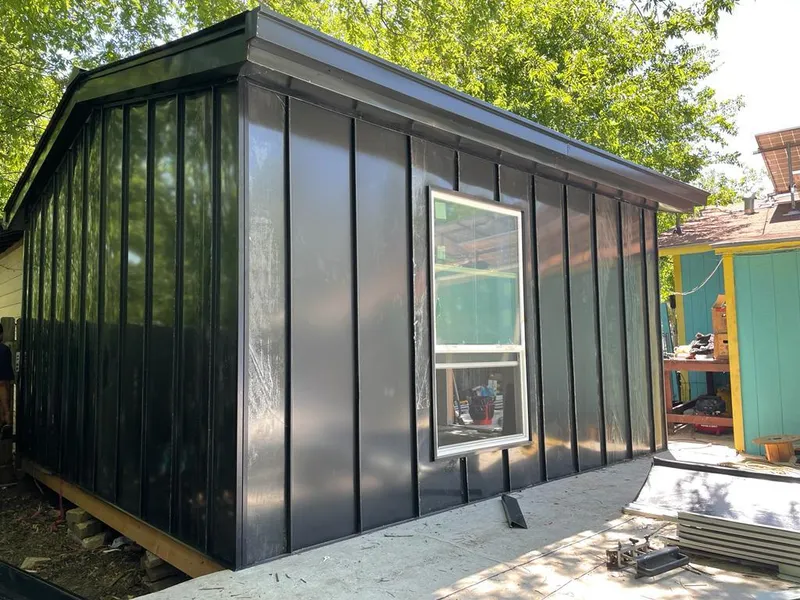 Black standing seam metal wall panels for Roof Inspection in Clearfield